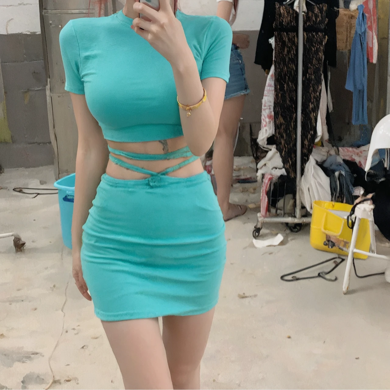 1girl, s41oc, wearing a crop top shirt and denim shorts standing in corn field on a farm, cowboy hat, red hair