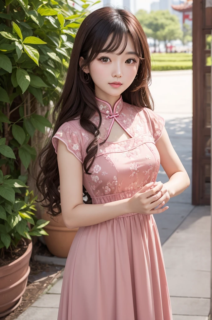 Chinese woman with brown curly hair with brown eyes and in dark pink dress