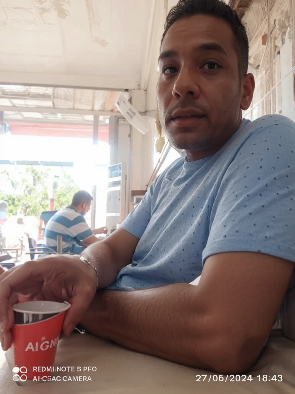 Change the background of this image and put this person on a beach.