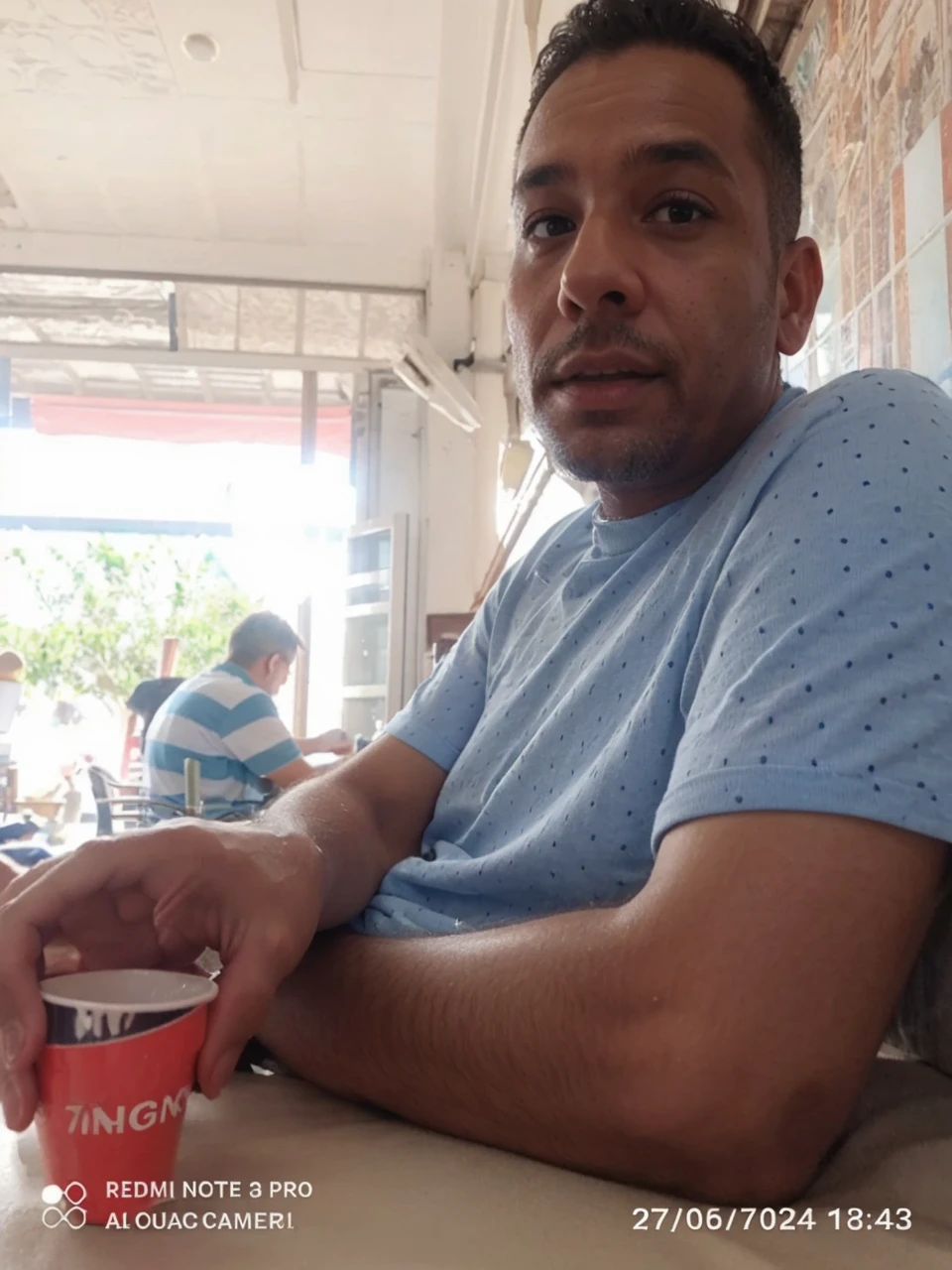 Change the background of this image and put this person on a beach.