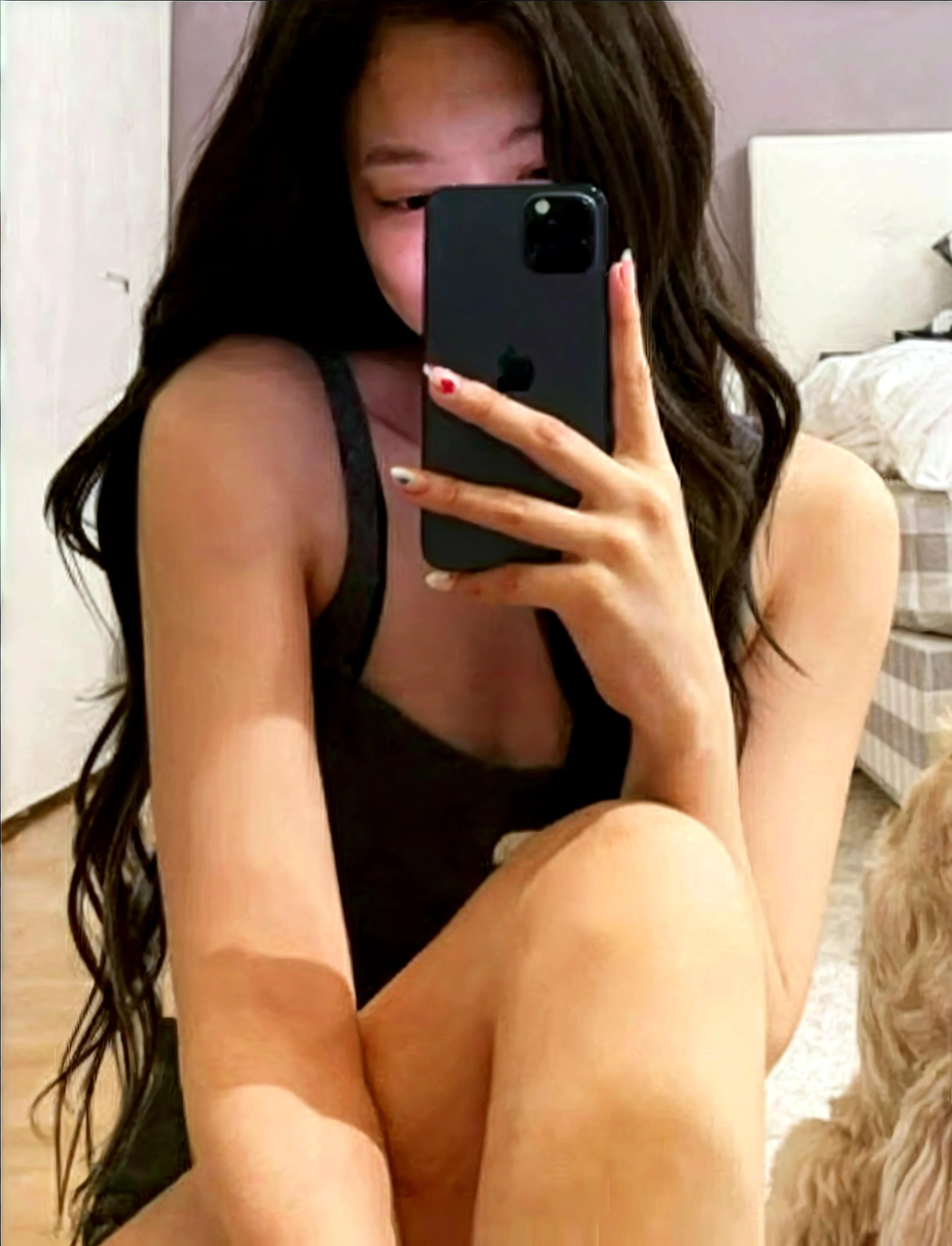 there is a woman Sitting on a bed taking a picture of herself, posing in a bedroom, Anna Nikonova aka Newmilky, Sitting on a bed, 18 years, sitting in bed, Pretty face with arms and legs, taken in 2 0 2 0, Instagram Template, thighs and skirt, with long hair and piercing eyes, sitting on her bed