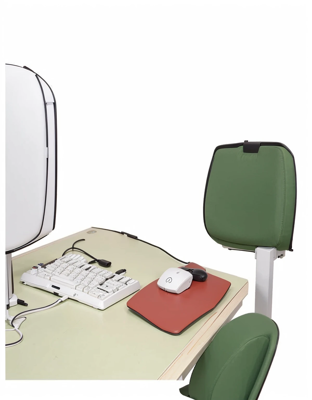 an office table a monitor a green chair a keyboard and a mouse a white wooden table