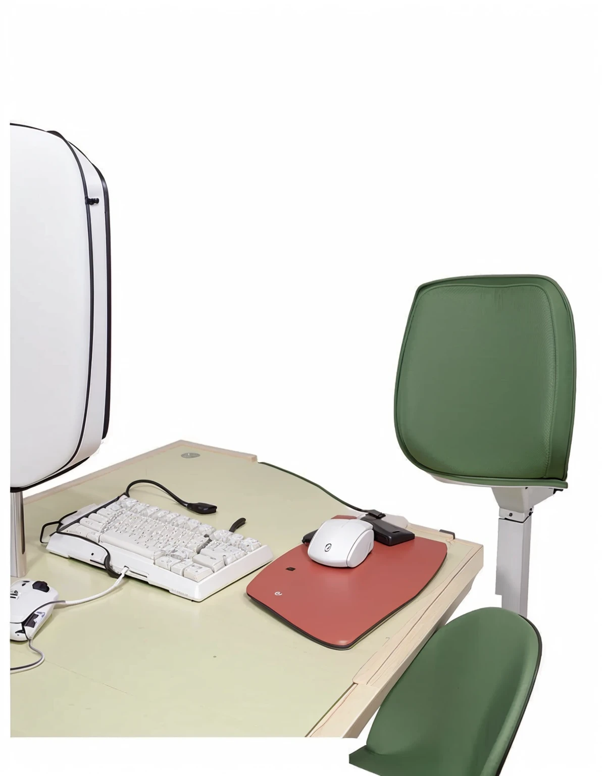 an office table a monitor a green chair a keyboard and a mouse a white wooden table