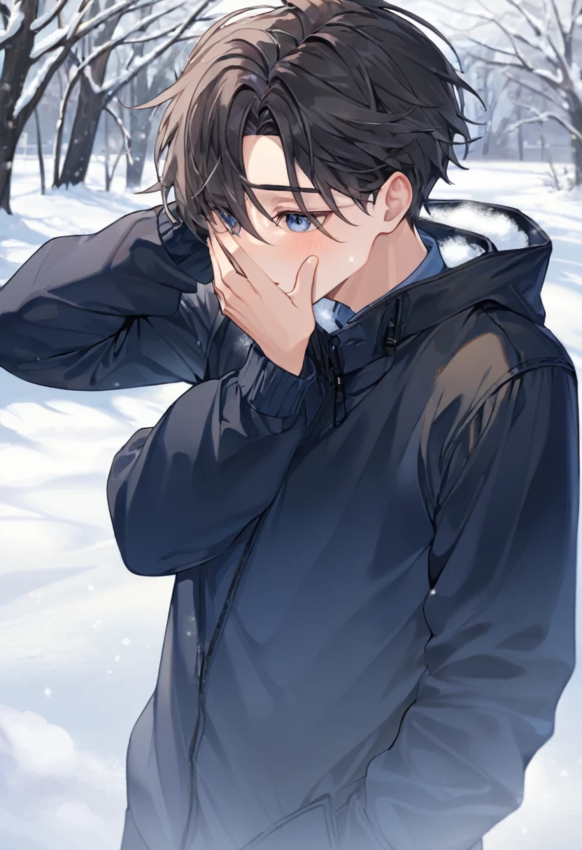 boy with a hand on his face covering himself from the snow