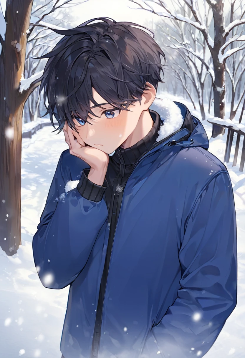 boy with a hand on his face covering himself from the snow