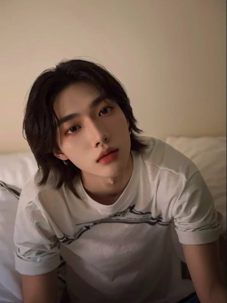 There's a man sitting on a bed with a remote control in his hand, Tommy 1 6 years, 1 7 year old boy, lean face, Hsiao-ron, xqc, 18 years old, androgynous face, cai xukun, cute androgynous prince, delicate androgynous prince, profile image