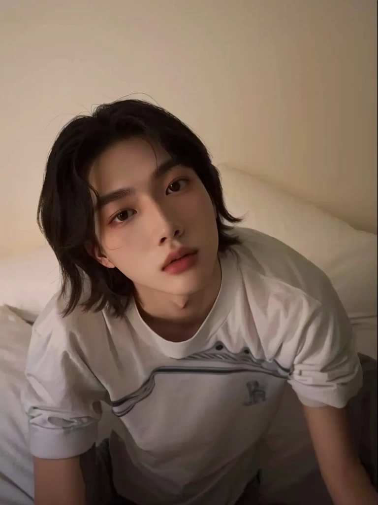 There's a man sitting on a bed with a remote control in his hand, Tommy 1 6 years, 1 7 year old boy, lean face, Hsiao-ron, xqc, 18 years old, androgynous face, cai xukun, cute androgynous prince, delicate androgynous prince, profile image