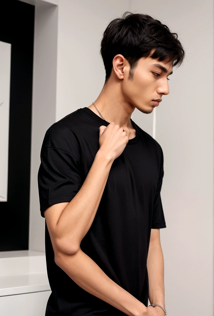 a man wearing oversized plain black tshirt.