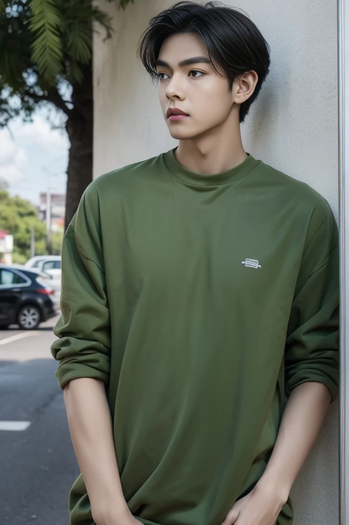 Young man in a green shirt Standing on the roadside with a serious expression, looking into the distance,Eyebrows frowned.,He looked worried.,Turn your head slightly.,Cloudy day, coffee shop