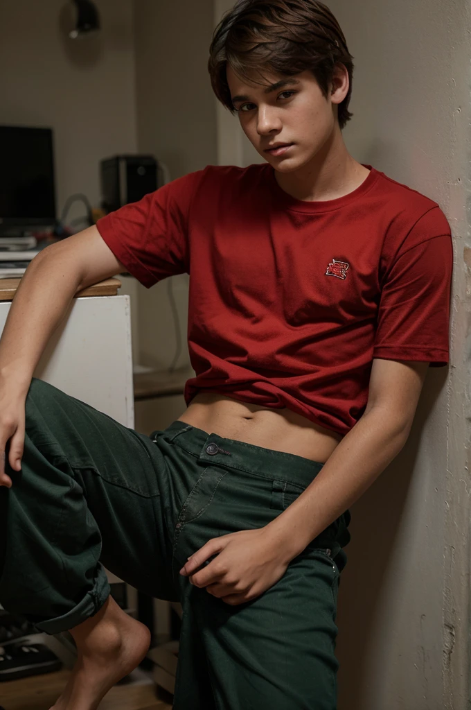 a age boy wearing a red shirt and long torn trousers