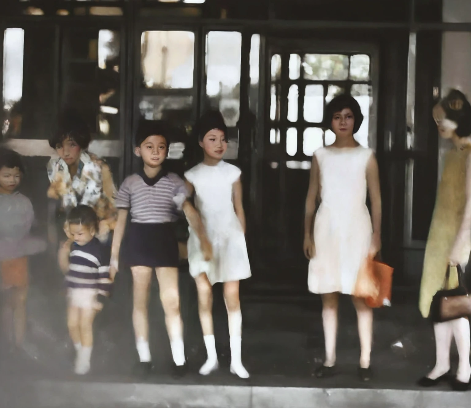 there are many mannequins of people standing in front of a building, colorized photo, colorized, a colorized photo, colourized, colorized photograph, 1960s color photograph, colourised, old color photograph, vintage footage on tokyo streets, inspired by Diane Arbus, grainy vintage, young girls, inspired by Ruth Orkin, old color photo