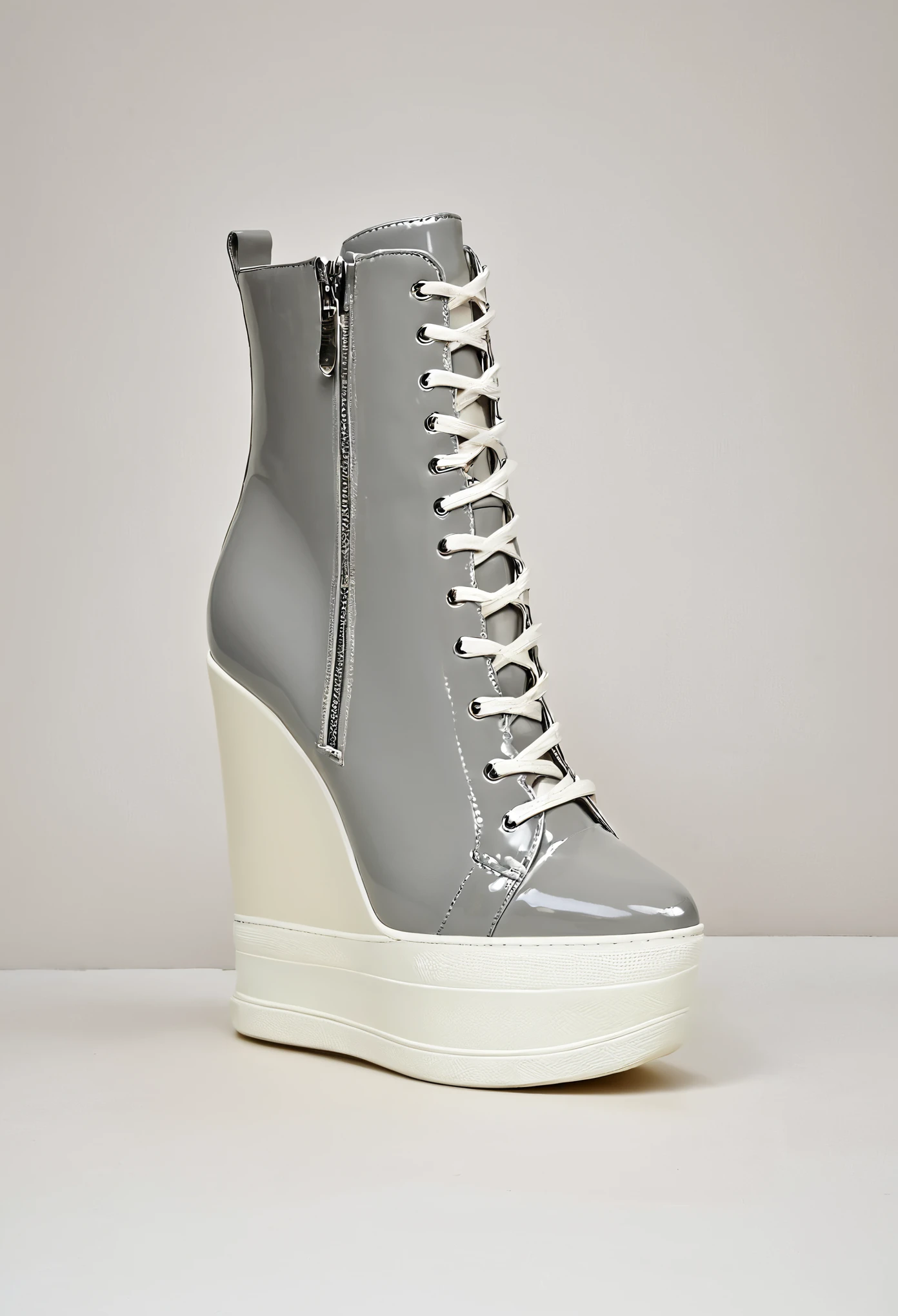 a shop window display, featuring pairs of women dancer's trainers. custom high top trainers. dainty pointed toe. reinforced very high top. grey and cream colour. chunky heel. zip fastening, front zip.