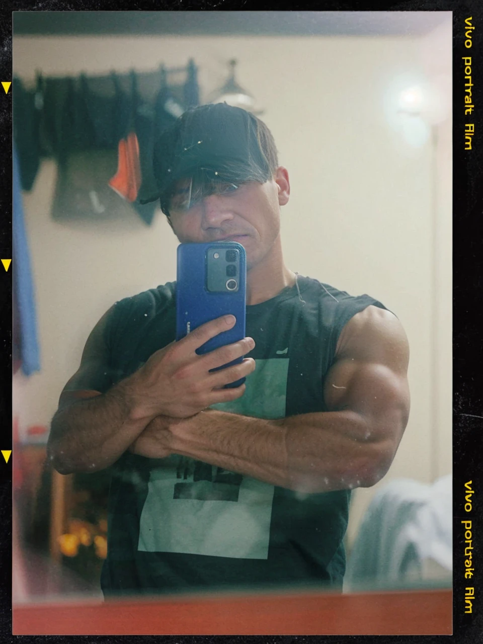 a 17 year old boy, short black hair, intense blue eyes, intense gaze, defined facial features, no facial hair, tall muscular build, broad shoulders, V-shaped body, wolf tattoo on right arm, full body focus, completely hairless, photorealistic, 8k, high quality, cinematic lighting, dramatic atmosphere, chiaroscuro lighting, moody color palette, dramatic rendering