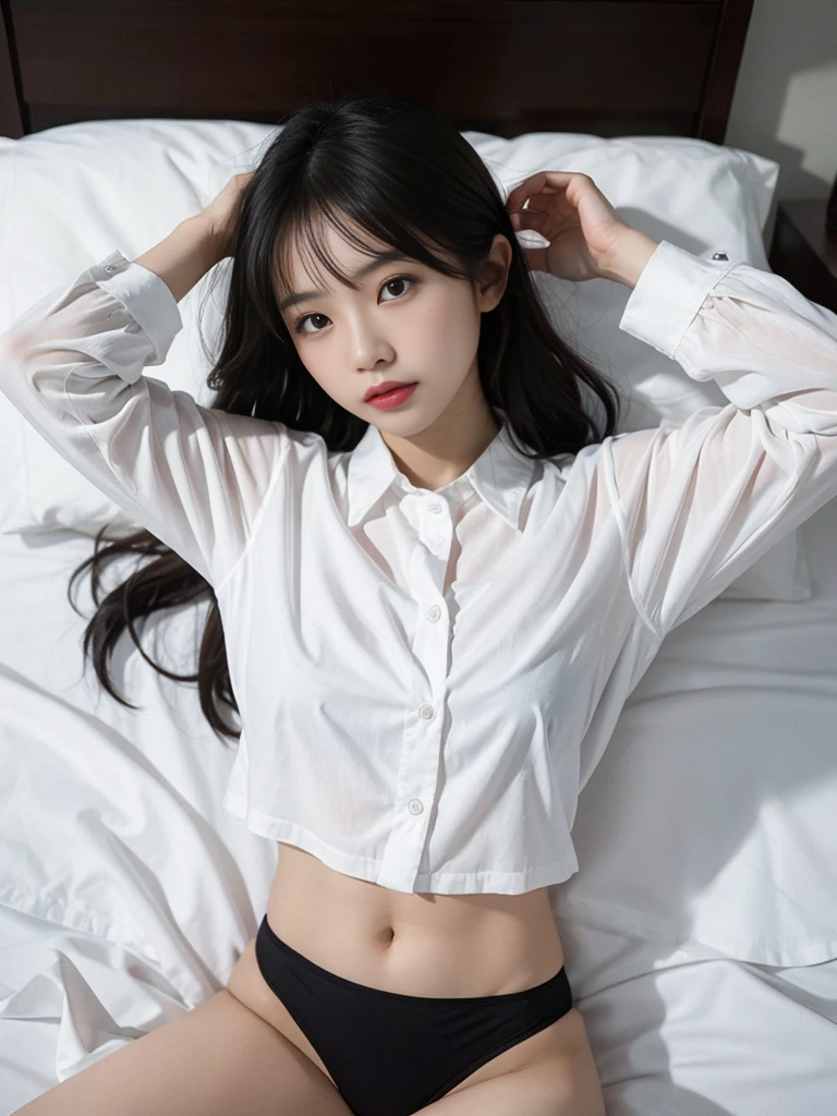 A rambunctious Asian woman in a white shirt and black panties lies on the bed.