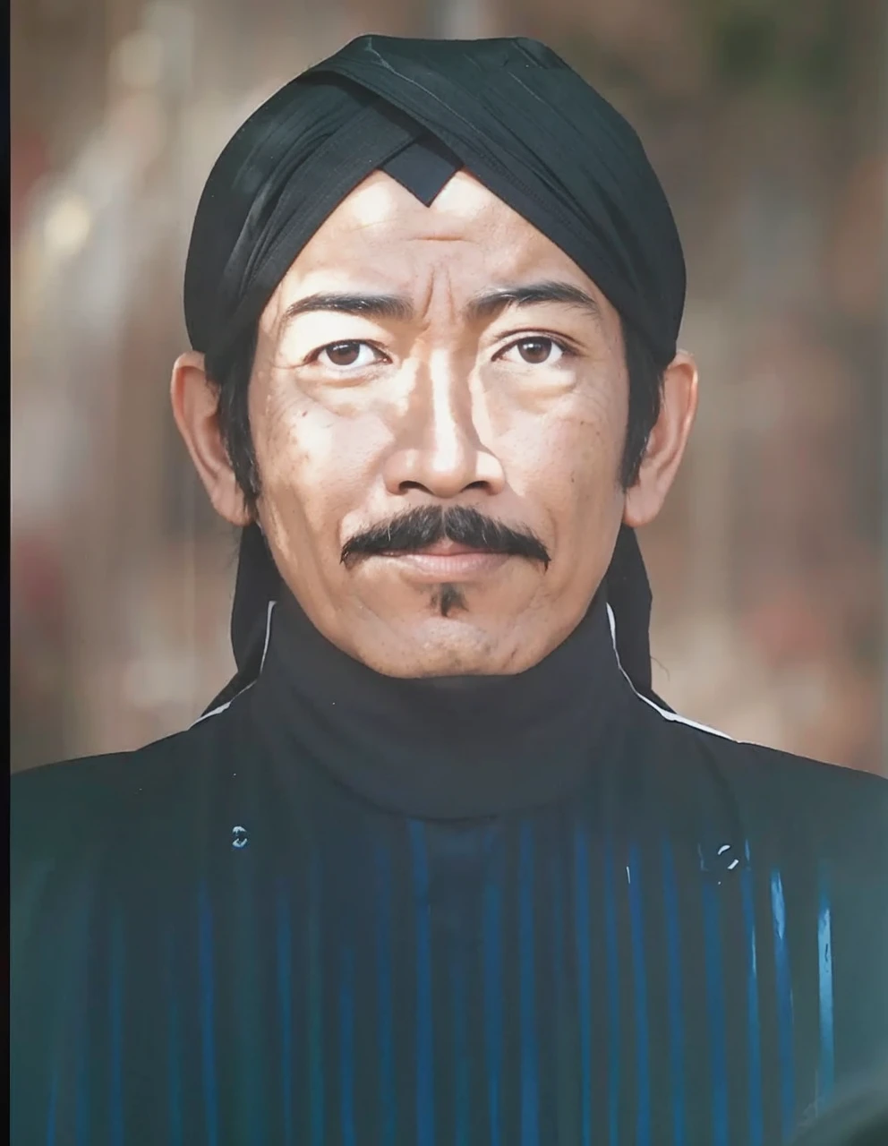 Indonesian Muslim man, aged 40 years or above, brown skin with wrinkles on the forehead, wearing Javanese ethnic clothing, thick mustache, slightly narrow eyes, realistic HD