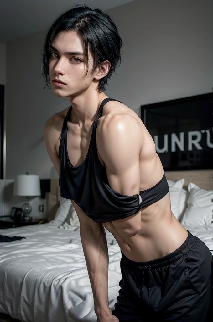 Man in black tank top tall and fit, with short black hair, while sexy modeling, in different places, in different positions.
