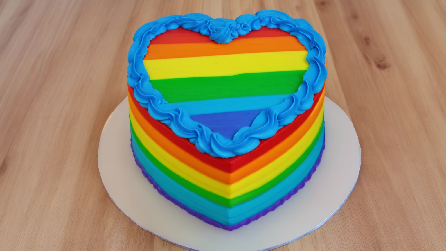 on a wooden table, worth a heart shaped cake, gradient rainbow cream ,top blue cream wave, cream texture, Realistic style, realistic texture, bright lighting, high quality, detailed texture, Beautiful light from the window, beautiful lighting, high detail, ultra 4k hd, super clear photo without blur