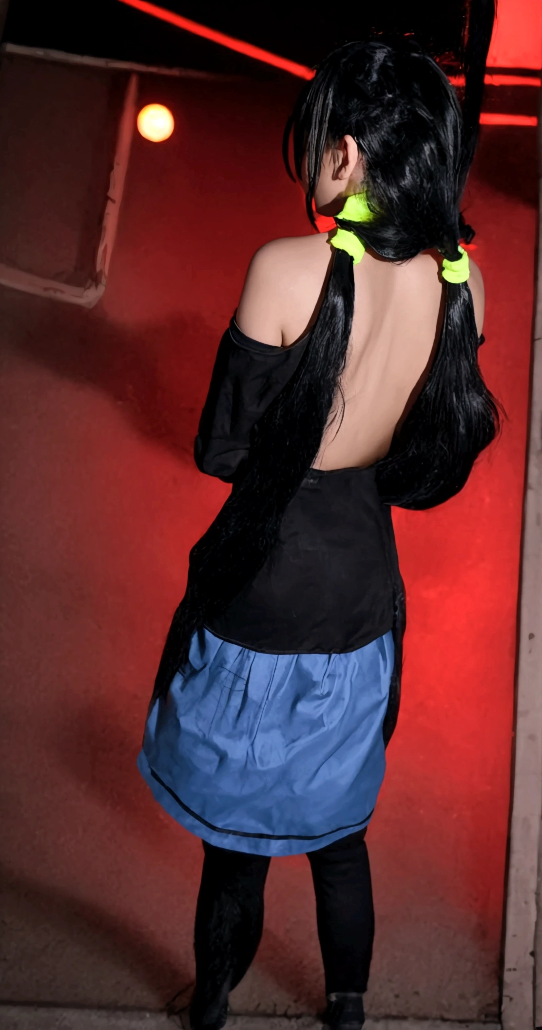 (top-quality, 8K, masterpiece:1.3) A photo of vibrant,
tokisaki kurumi, heterochromatic eyes, right red eyes, left yellow eyes, black hair, long hair, twintails, asymmetrical twintails,(hands behind back:1.3),
wearing a neon pink off-the-shoulder sweatshirt, high-waisted acid wash jeans, and white Keds,
standing in front of a retro-futuristic cityscape at dusk, with neon lights reflecting off the wet pavement,
taken with cowboy shot, portrait mode, highly detailed, detailed skin,
dramatic, warm, and moody neon-lit lighting with a hint of fog.
