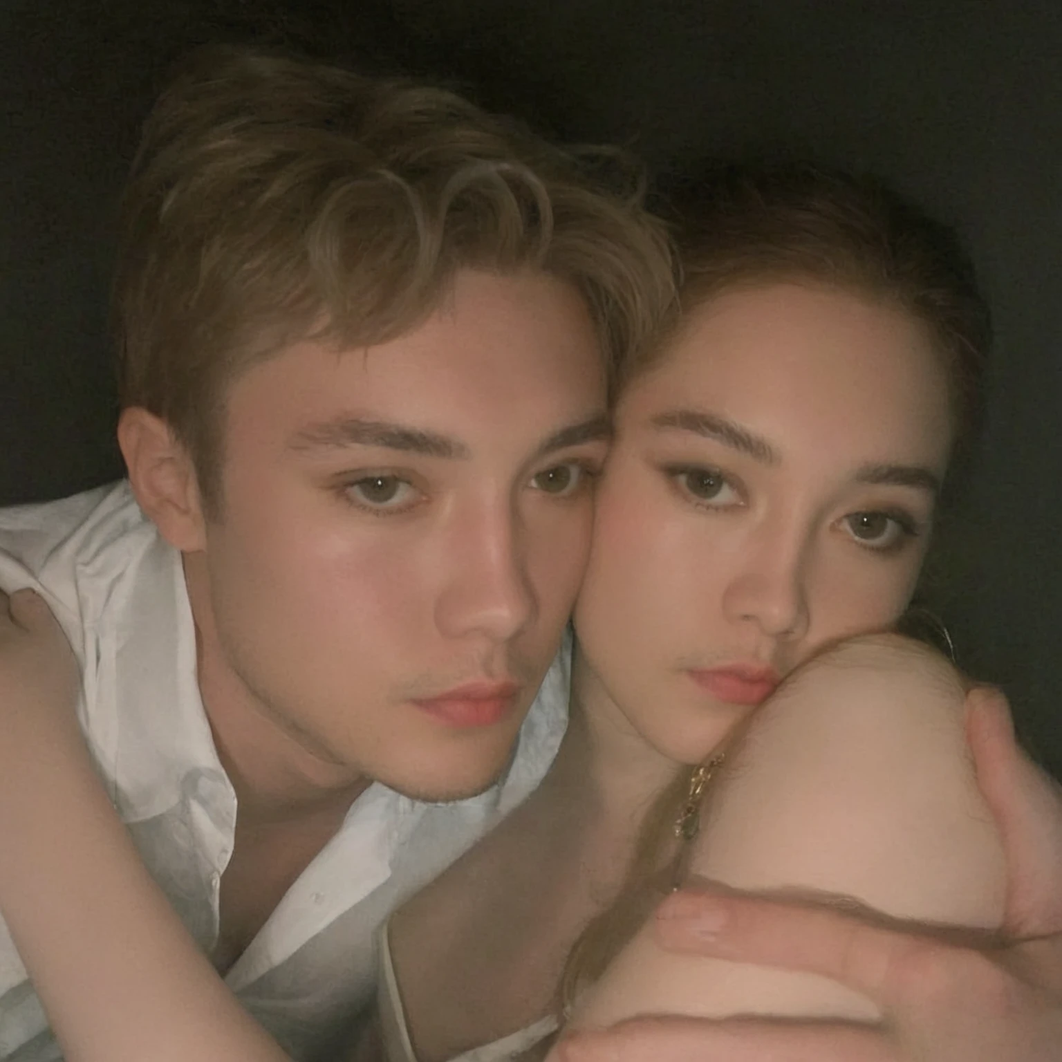 An Asian man and woman couple are posing together for a photo in a dark room., taken in the early 2020s, In the style of Petra Collins, leaked image, amaranth, leaked photo, young beautiful amaranth, very very good quality image, 1614572159, petra collins, valentine shuffle, Jordan Grimmer and Natasha Tan