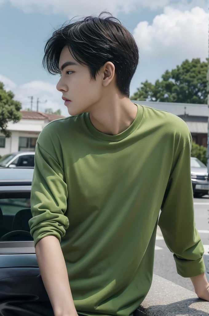 Young man in a green shirt Standing on the roadside with a serious expression, looking into the distance,Eyebrows frowned.,He looked worried.,Turn your head slightly.,Cloudy day, coffee shop