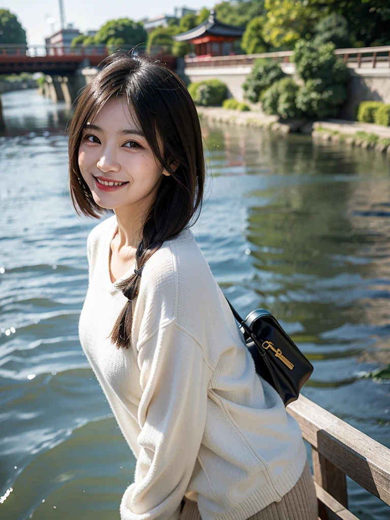 Smiling Asian woman with Kyoto river in the background