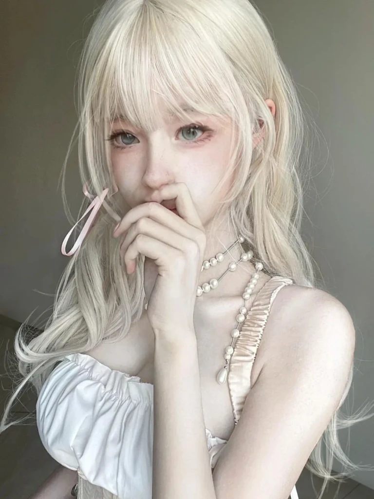 blonde-haired girl with pink scissors in her mouth and a white dress, pale milky white porcelain skin, pale porcelain white skin, anime girl in real life, long white hair and bangs, young pale ghost, chica anime cosplay, extremely pale blonde hair, white hime cut hairstyle, beautiful dolphin, very very pale blonde hair, with long white hair, realistic young anime girl