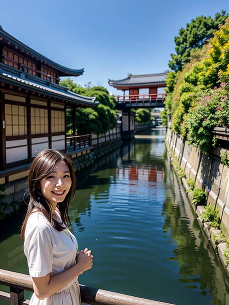 Smiling Asian woman with Kyoto river in the background