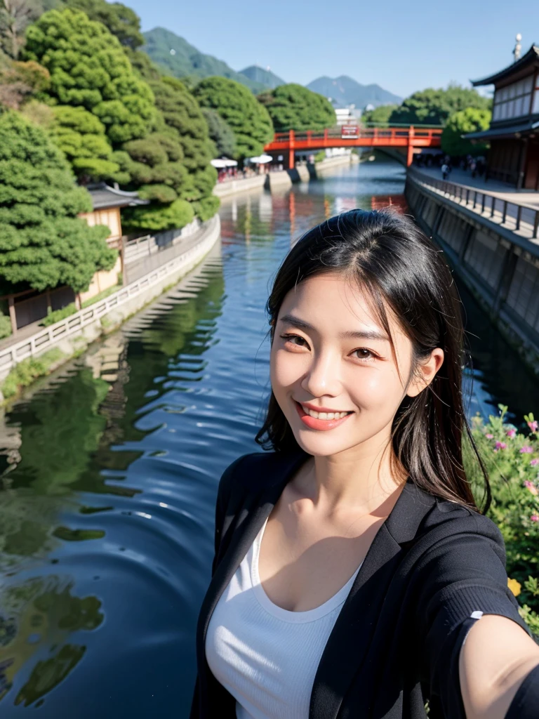 Smiling Asian woman with Kyoto river in the background