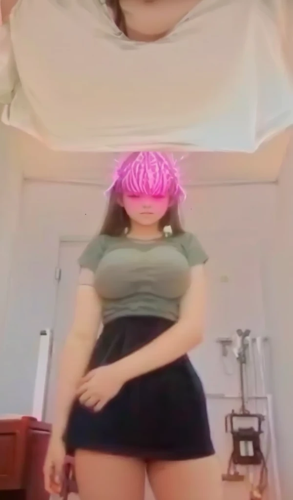 A 13 year old woman shows off her genitals and large breasts.