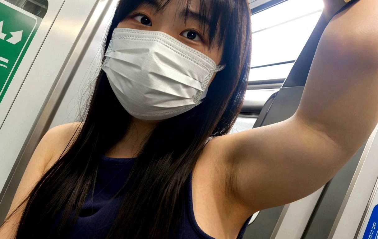 Young Japanese woman wearing a mask on the subway train, Wear a mask, Big Big Breasts、White shirt,Inside the train, Wearing a mask, Selfie taken at a straight angle, Showing armpits,