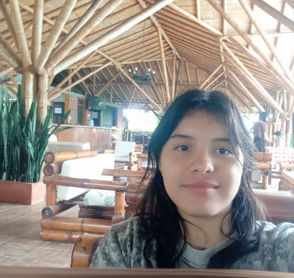 there is a woman taking a selfie in a restaurant, without makeup, slightly smiling, Inside image, in the midst of nature, taken with the best dlsr camera, frontal photo, inside shot, with mountains in the background, ayahuasca, selfie of a young woman, very slightly smiling, taken on go pro hero8, with a friendly face, try it, indoor environment