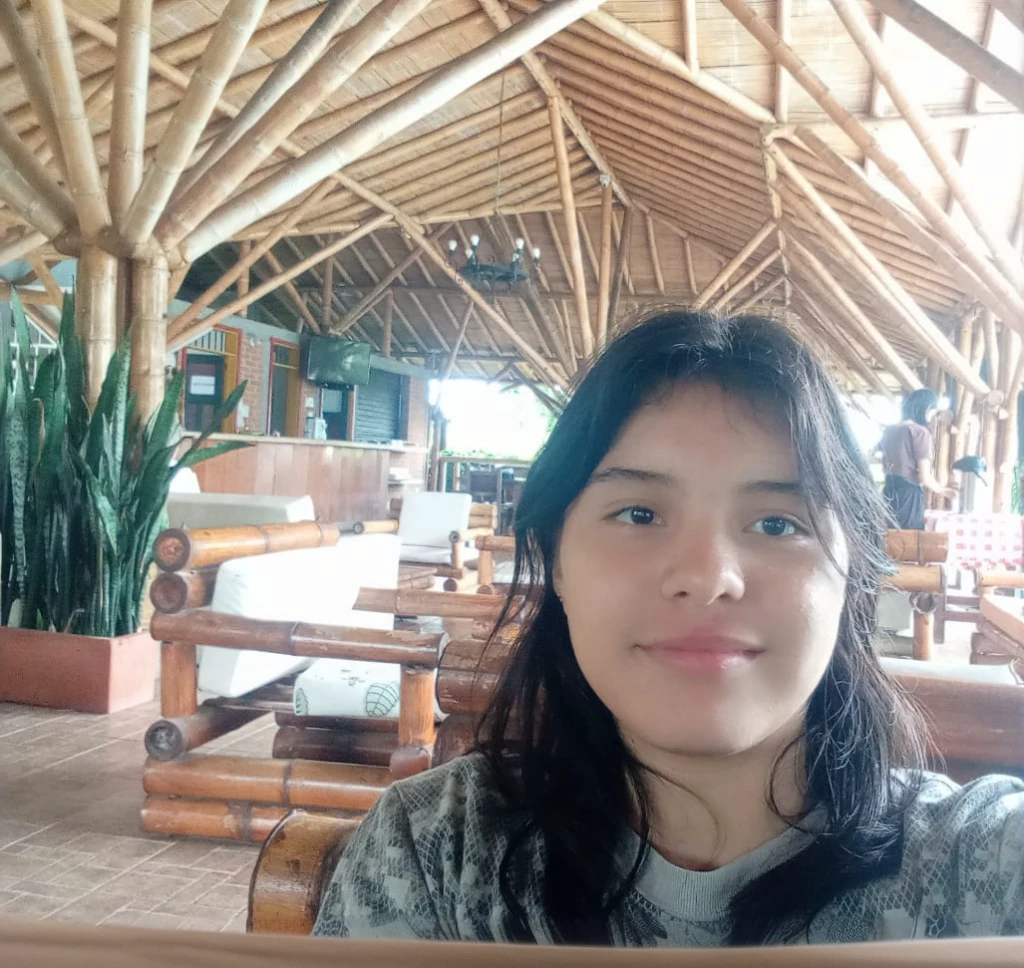 there is a woman taking a selfie in a restaurant, without makeup, slightly smiling, Inside image, in the midst of nature, taken with the best dlsr camera, frontal photo, inside shot, with mountains in the background, ayahuasca, selfie of a young woman, very slightly smiling, taken on go pro hero8, with a friendly face, try it, indoor environment