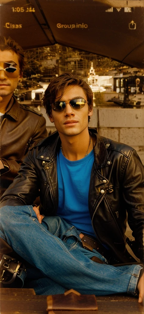 Guy wears sunglasses and leather jacket