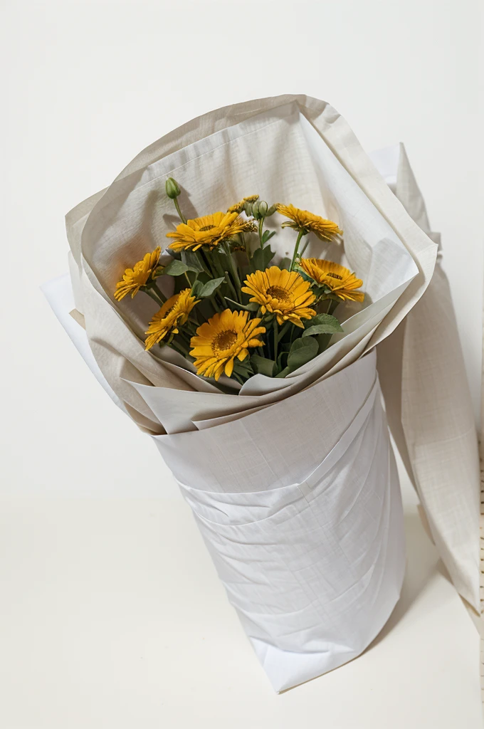 a bouquet of flowers of similar colors in fabric wrapping on a white background without unnecessary details