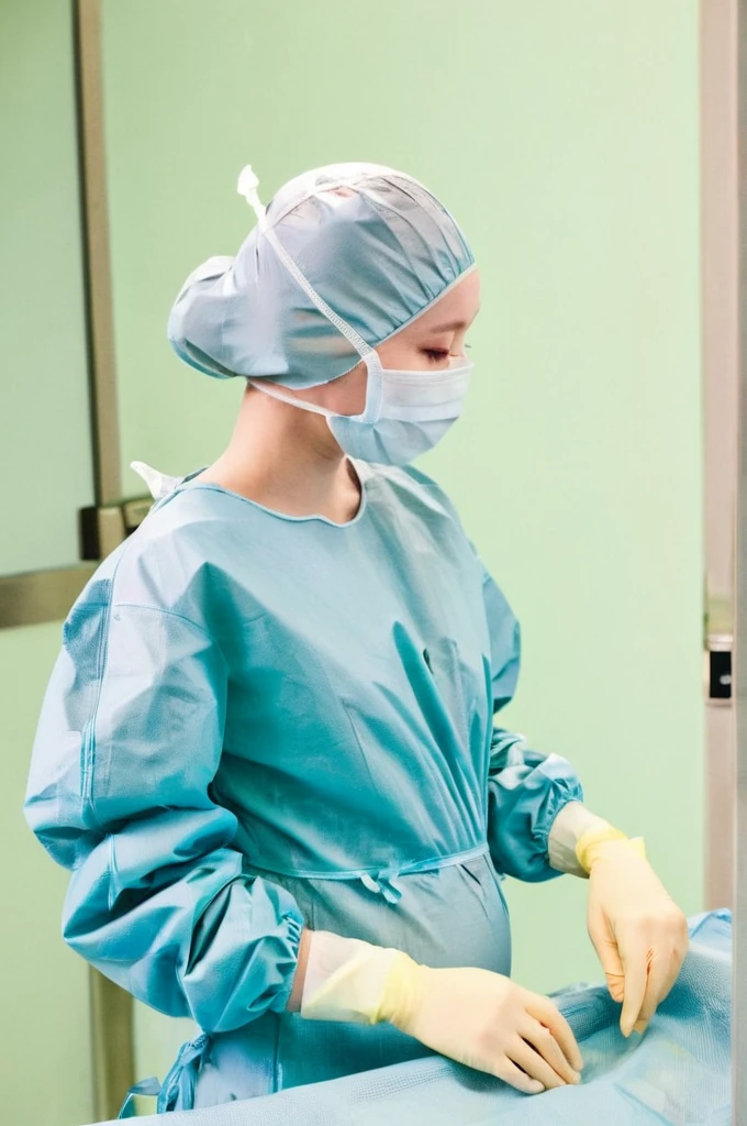 score_9,  score_8_up, score_7_up, masterpiece, highest quality, pale skin, shy eyes, cover the ears, big breasts, surgical mask, surgical cap, long sleeve surgical gown, pregnant about 7 8 months, 
1 girl, pregnant, solo, rubber gloves, frown,  standing, in one hospital, hospital bed, 
