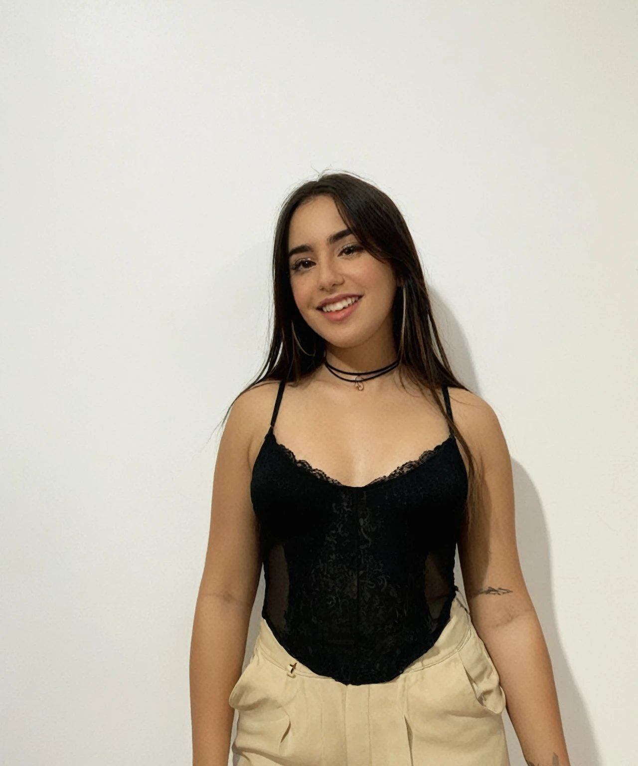 There is a woman posing for a photo in a black top., Alanis Guillén, Bralette, 18 years, Julia Fuentes, wearing a black jumpsuit, lorena avarez, she is wearing a black tank top, wearing a sexy crop top, 21 years, 16 years old, profile picture, sexy look