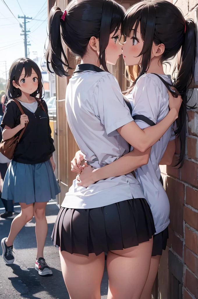 A girl showing her ass while two girls kiss