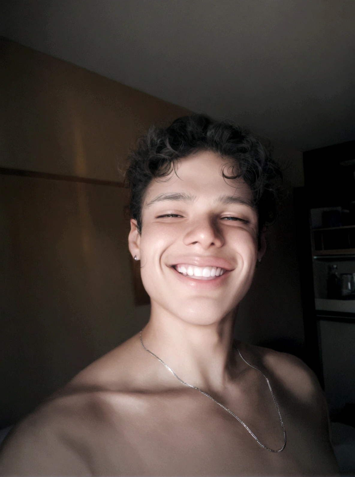 boy smiling in a hotel room