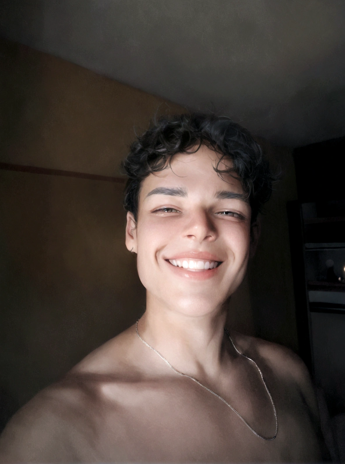 boy smiling in a hotel room