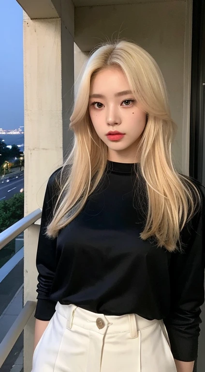 A young Korean woman with blonde dyed hair, pale skin, thin body. She has a small mole below her left eye, making her even more charming. She is wearing a chic black shirt and black leather pants . She is looking at the viewer, and her easy expression is sensual. Full body. The setting is a balcony of a luxurious apartment at night with the city in the background. Masterpiece, high quality.