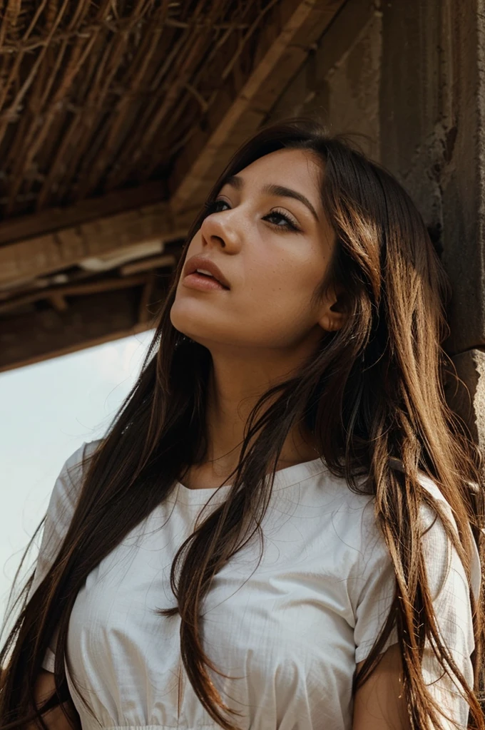 a woman looks up with long hair 
