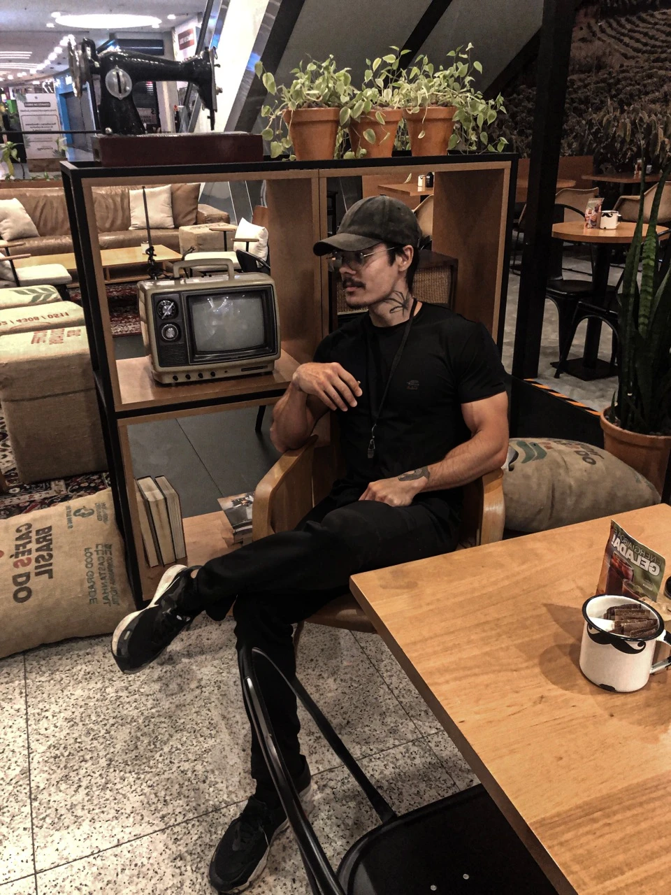 Strong man sitting on the chair, muscular, strong and big arms, handsome and charming man