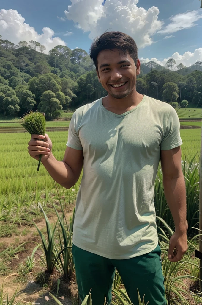 Man with hardworker face smiling with happiness in the middle of green ricefield held a hoe