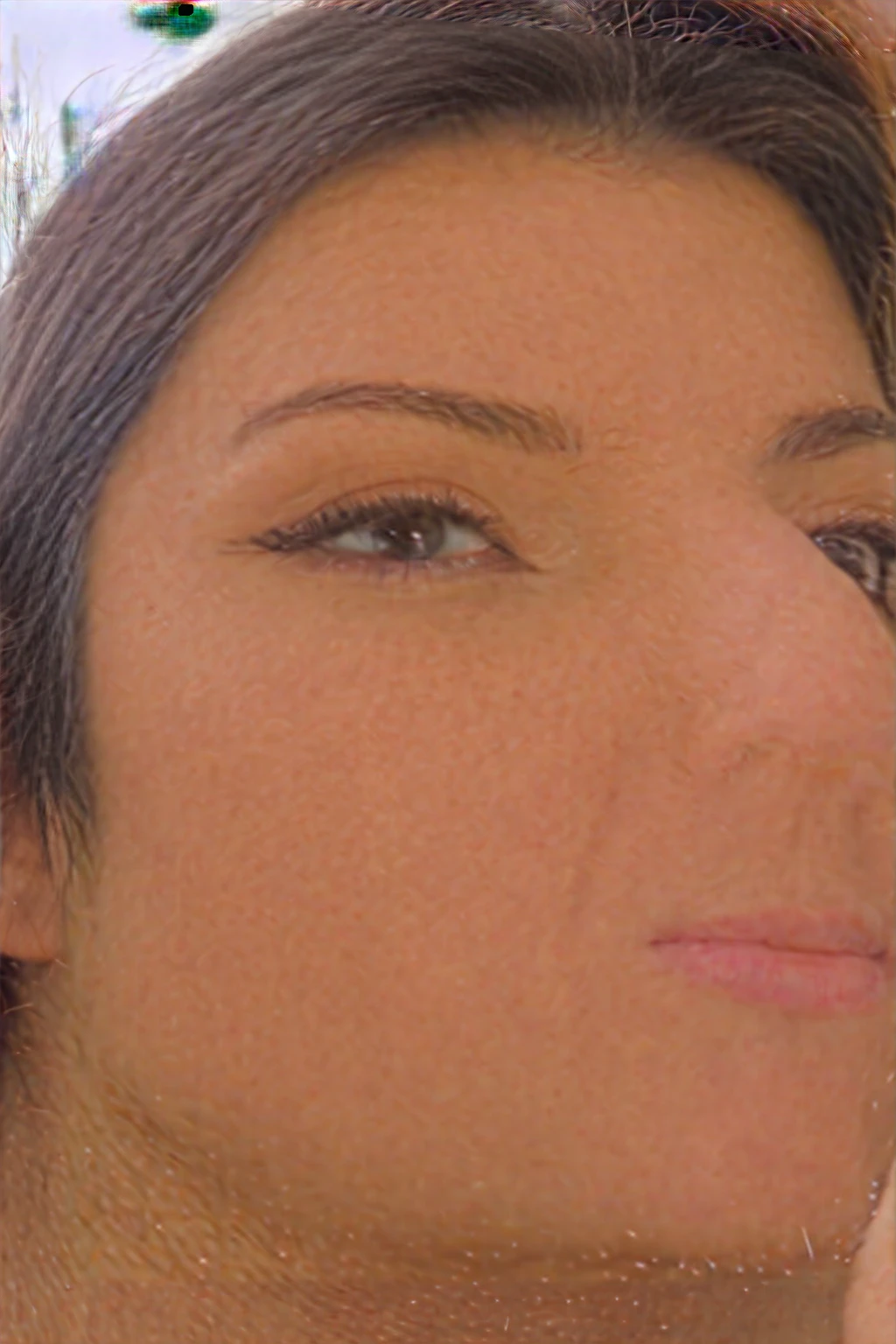 A young 19-year-old woman named Lila Nakamura with a mixed Japanese and Northern European heritage. She has thick dark black eyeliner, glossy lips, and a cute, endearing expression. She has straight, black hair with blonde highlights or a blonde tint that falls just past her shoulders, styled in a neat and polished manner. Her eyes are almond-shaped with a light, striking blue color, accentuated by subtle eyeshadow and mascara. Her skin has a light tone with a natural, fresh look, and she has a few delicate freckles across her nose. She is wearing a simple, professional outfit, consisting of a white blouse and dark jeans, and accessorized with small gold hoop earrings. The background is a neutral studio setting with soft lighting to highlight her features.