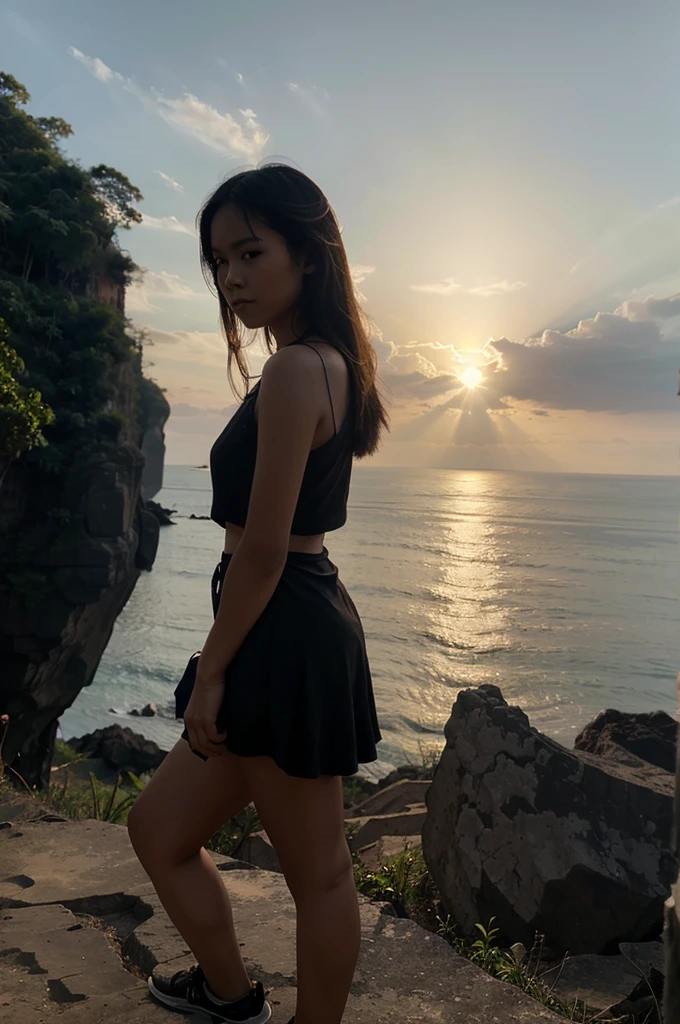 A young thai woman stands on a cliff. Waiting for someone, backlit image, silhouette