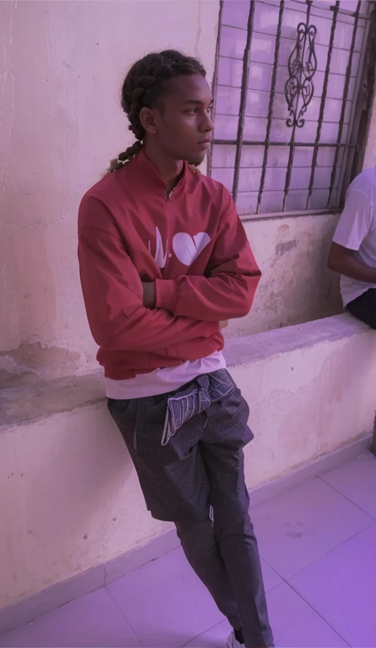 Young man with braid and suit and naiki tennis shoes 