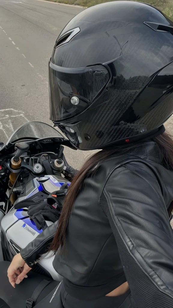 arafed woman in a black leather jacket and helmet on a motorcycle, wearing his helmet, Hull view, wearing a helmet, wearing helmet, photo of a female motorcyclist, Reflection on the helmet, helmet on, reflection of the phone in the visor, wearing a helmet redondo, helmet on face, riding a motorcycle, holding helmet, riding on the road, photo from behind