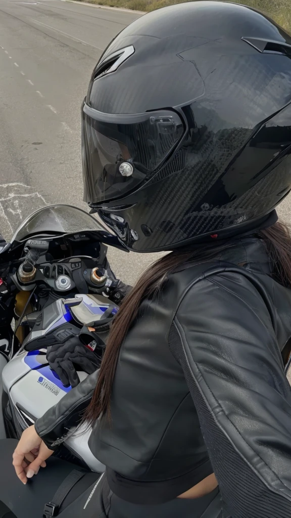 arafed woman in a black leather jacket and helmet on a motorcycle, wearing his helmet, Hull view, wearing a helmet, wearing helmet, photo of a female motorcyclist, Reflection on the helmet, helmet on, reflection of the phone in the visor, wearing a helmet redondo, helmet on face, riding a motorcycle, holding helmet, riding on the road, photo from behind