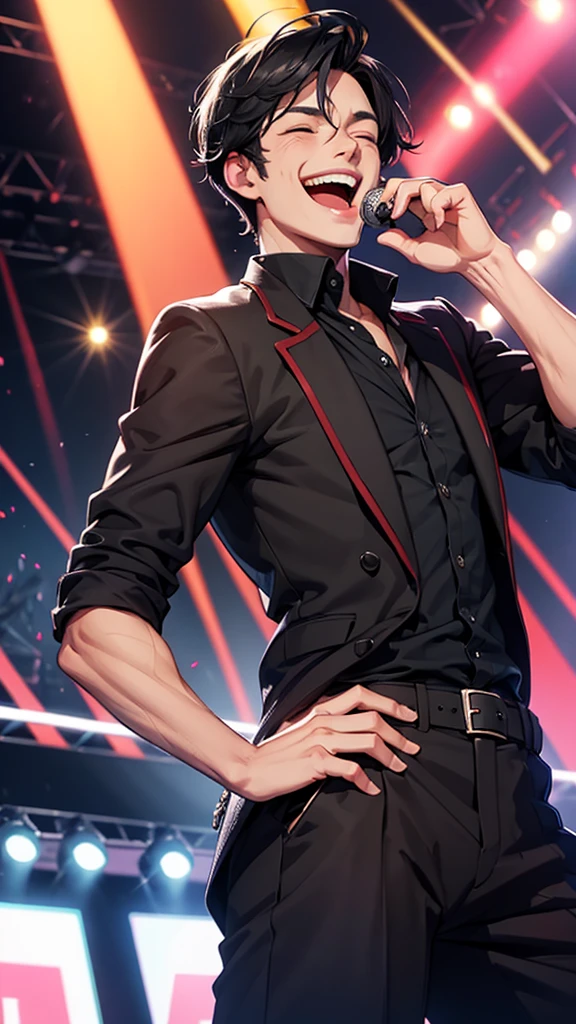A handsome man with black hair laughing on stage
