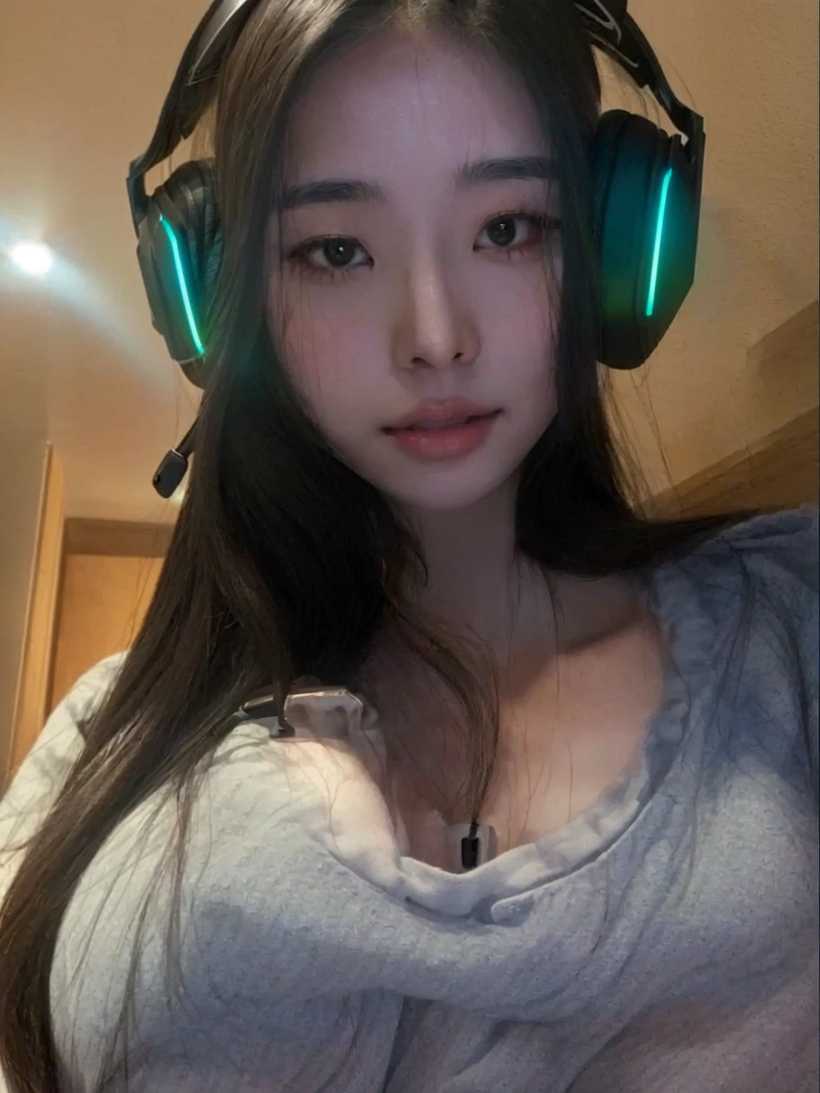 a close-up of a woman with headphones and a gray shirt, 27 years old, 22 years, 28 years old, 23 years, 21 years, Asian girl, 18 years, 29 years, 24 years old, beautiful Asian girl, japanese goddess, Amazing beauty, Amazing beauty